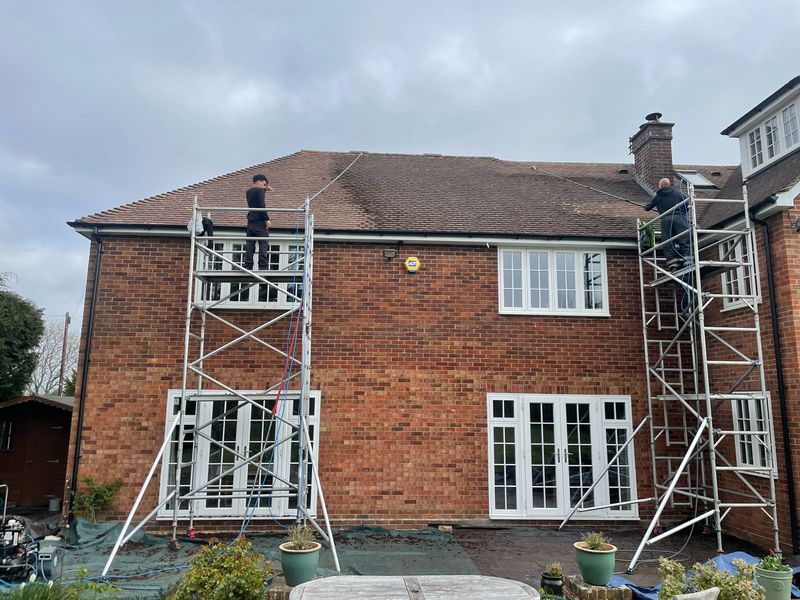 Roof cleaning carried out safely from scaffold towers by The Roof Moss Cleaners in Staple Hill